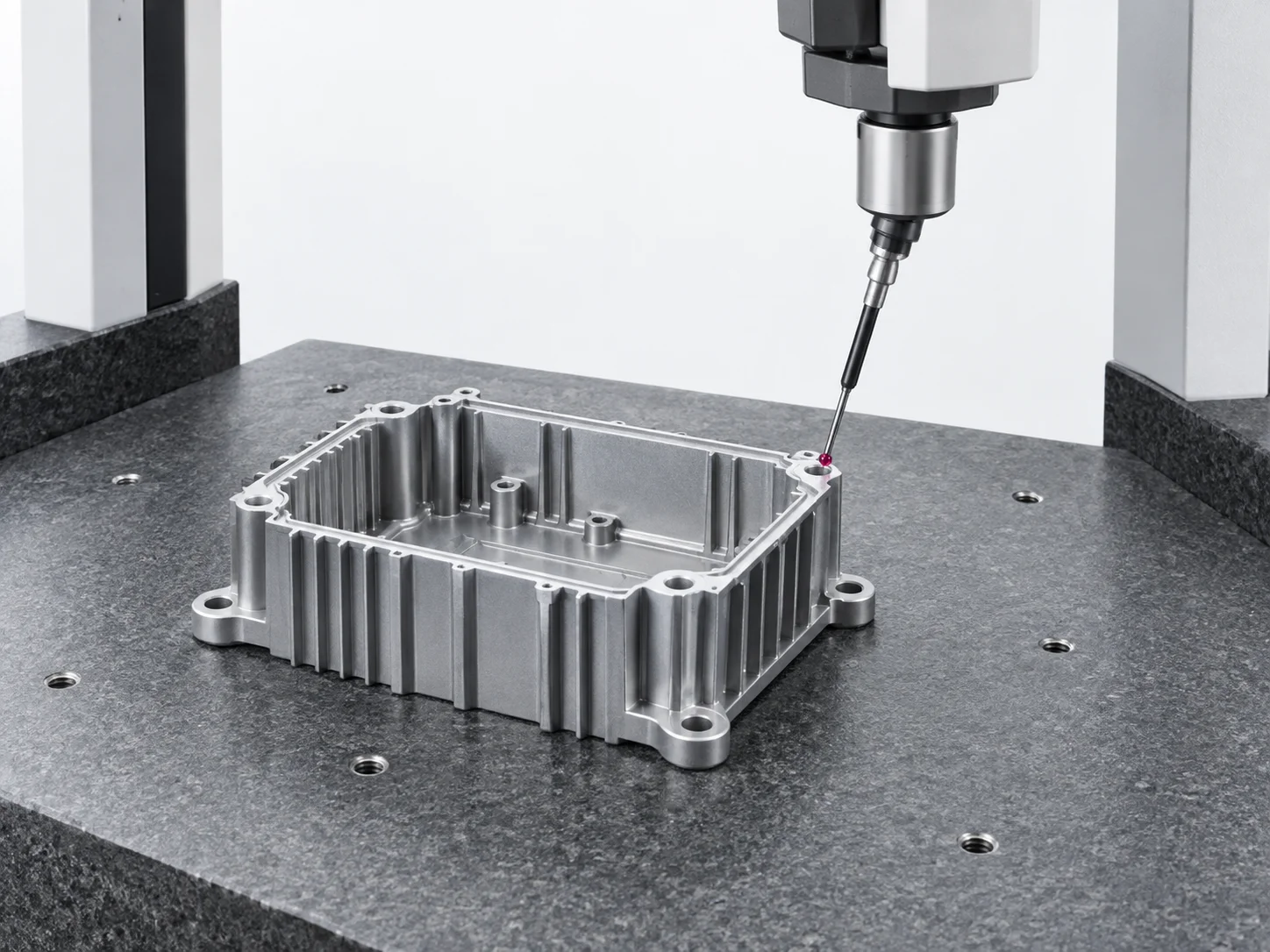 Process illustration of a CMM probe inspecting a die-cast aluminum enclosure